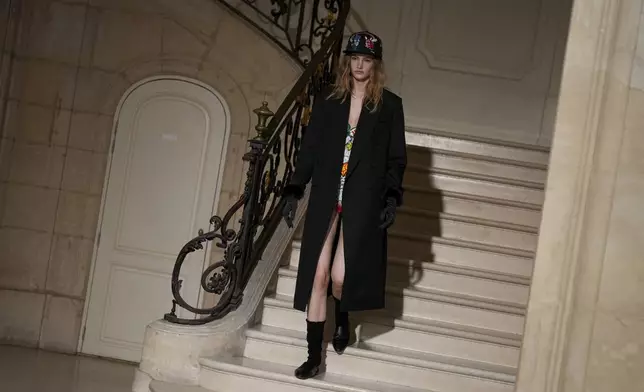 A model wears a creation as part of the Kenzo Fall/Winter 2025-2026 Womenswear collection presented in Paris, Friday, March 7, 2025. (Photo by Scott A Garfitt/Invision/AP)