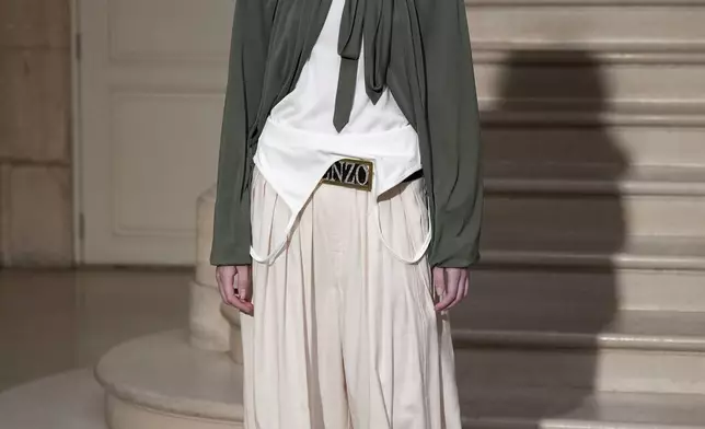 A model wears a creation as part of the Kenzo Fall/Winter 2025-2026 Womenswear collection presented in Paris, Friday, March 7, 2025. (Photo by Scott A Garfitt/Invision/AP)