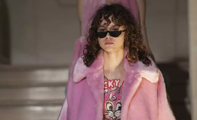 A model wears a creation as part of the Kenzo Fall/Winter 2025-2026 Womenswear collection presented in Paris, Friday, March 7, 2025. (Photo by Scott A Garfitt/Invision/AP)