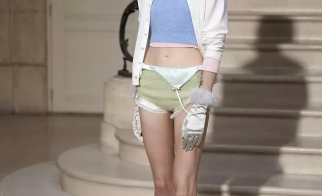 A model wears a creation as part of the Kenzo Fall/Winter 2025-2026 Womenswear collection presented in Paris, Friday, March 7, 2025. (Photo by Scott A Garfitt/Invision/AP)