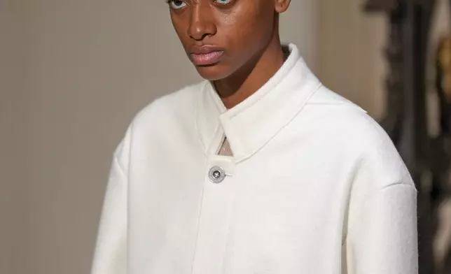 A model wears a creation as part of the Kenzo Fall/Winter 2025-2026 Womenswear collection presented in Paris, Friday, March 7, 2025. (Photo by Scott A Garfitt/Invision/AP)