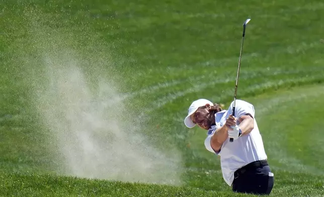 Tommy Fleetwood, of England, hits from a fairway bunker on the ninth hole during the first round of the Valspar Championship golf tournament Thursday, March 20, 2025, at Innisbrook in Palm Harbor, Fla. (AP Photo/Chris O'Meara)