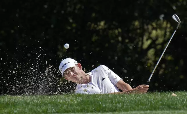 Jacob Bridgeman blasts from a sand trap on the seventh hole during the first round of the Valspar Championship golf tournament Thursday, March 20, 2025, at Innisbrook in Palm Harbor, Fla. (AP Photo/Chris O'Meara)