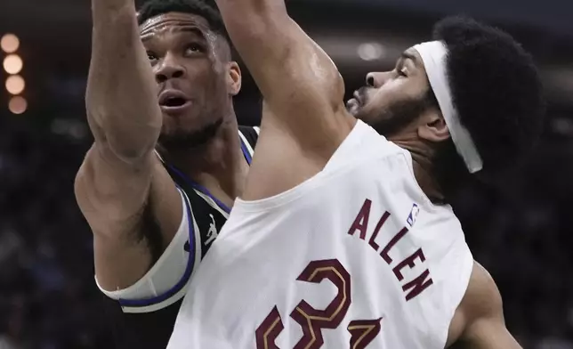 Milwaukee Bucks' Giannis Antetokounmpo shoots past Cleveland Cavaliers' Jarrett Allen during the first half of an NBA basketball game Sunday, Mar. 9, 2025, in Milwaukee. (AP Photo/Morry Gash)