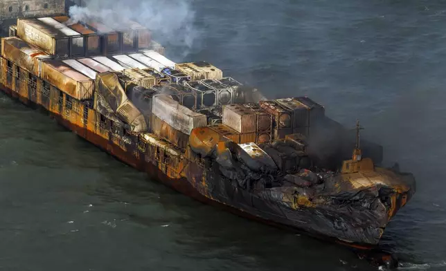 Smoke billows from the MV Solong cargo ship in the North Sea, off the Yorkshire coast in England, Tuesday, March 11, 2025. (Dan Kitwood/Pool Photo via AP)