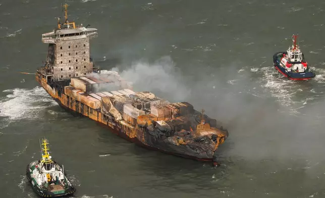 Smoke billows from the MV Solong cargo ship in the North Sea, off the Yorkshire coast, Tuesday, March 11, 2025, in England. (Dan Kitwood/Pool Photo via AP)