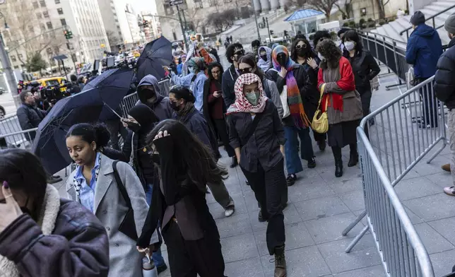 Students from Columbia University arrive at the Manhattan federal court prior to the deportation case of Mahmoud Khalil, Wednesday, March 12, 2025, in New York. (AP Photo/Stefan Jeremiah)