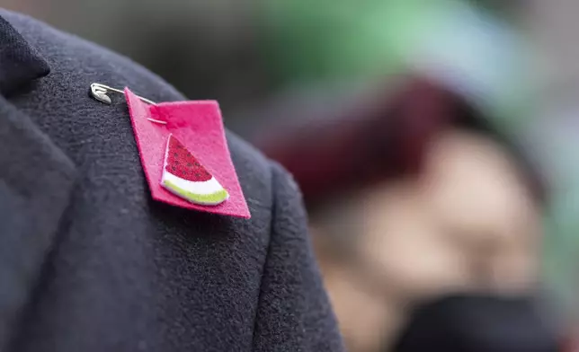 A person wearing a watermelon badge on their shoulder in Foley Square, outside the Manhattan federal court, in support of Mahmoud Khalil, Wednesday, March 12, 2025, in New York. (AP Photo/Stefan Jeremiah)