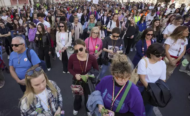 People march in support of women on the International Women's Day in Belgrade, Serbia, Saturday, March 8, 2025. (AP Photo/Darko Vojinovic)