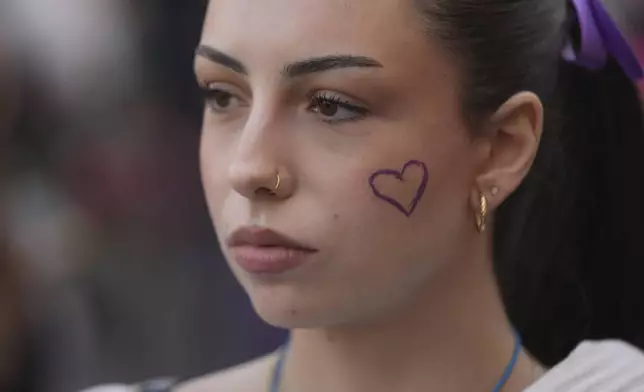 People march in support of women on the International Women's Day in Belgrade, Serbia, Saturday, March 8, 2025. (AP Photo/Darko Vojinovic)