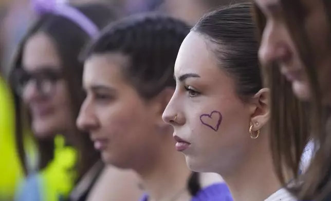 People march in support of women on the International Women's Day in Belgrade, Serbia, Saturday, March 8, 2025. (AP Photo/Darko Vojinovic)