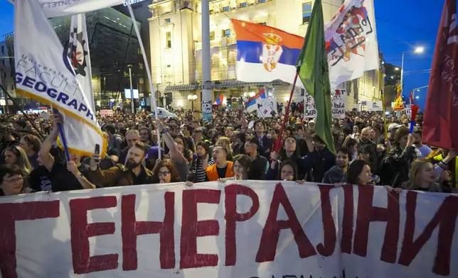 Students and citizens march to protest the deaths of 15 people killed in the November collapse of a train station canopy in Belgrade, Serbia, Saturday, March 8, 2025. (AP Photo/Darko Vojinovic)