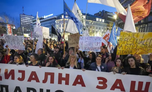 Students and citizens march to protest the deaths of 15 people killed in the November collapse of a train station canopy in Belgrade, Serbia, Saturday, March 8, 2025. (AP Photo/Darko Vojinovic)