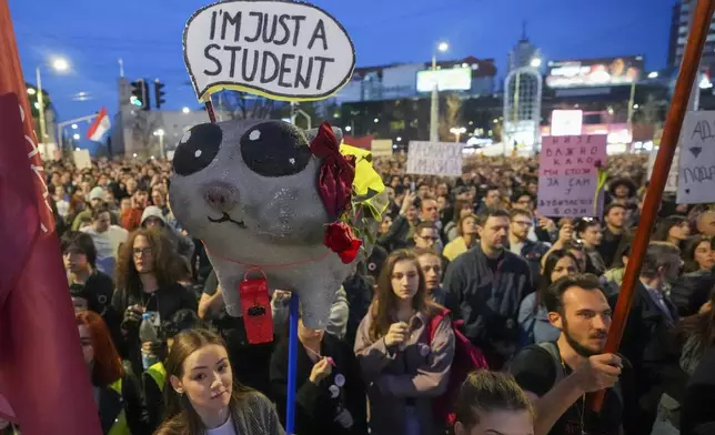 Students and citizens march to protest the deaths of 15 people killed in the November collapse of a train station canopy in Belgrade, Serbia, Saturday, March 8, 2025. (AP Photo/Darko Vojinovic)
