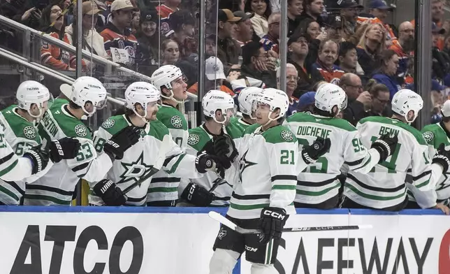 Dallas Stars' Jason Robertson (21) celebrates a goal against the Edmonton Oilers during the second period of an NHL game in Edmonton on Wednesday, March 26, 2025. (Jason Franson/The Canadian Press via AP)