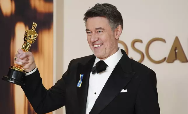Peter Straughan, winner of the award for best adapted screenplay for "Conclave," poses in the press room at the Oscars on Sunday, March 2, 2025, at the Dolby Theatre in Los Angeles. (Photo by Jordan Strauss/Invision/AP)