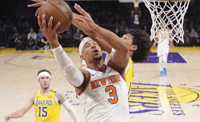 New York Knicks guard Josh Hart (3) shoots as Los Angeles Lakers center Jaxson Hayes (11) defends during the first half of an NBA basketball game Thursday, March 6, 2025, in Los Angeles. (AP Photo/Mark J. Terrill)