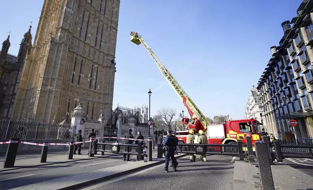 Emergency services at the Palace of Westminster in London after man with a Palestine flag climbed up Elizabeth Tower, which houses Big Ben,Saturday, March 8, 2025. (James Manning/PA via AP)
