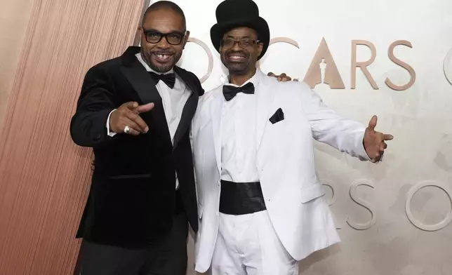 Clarence Maclin, left, and Divine G arrive at the Oscars on Sunday, March 2, 2025, at the Dolby Theatre in Los Angeles. (Photo by Jordan Strauss/Invision/AP)