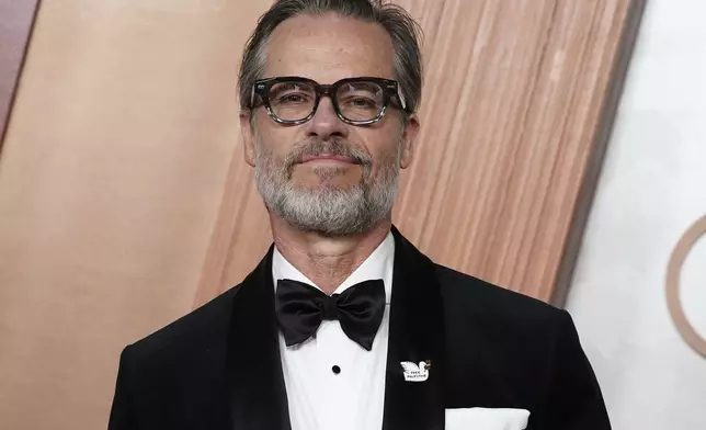 Guy Pearce arrives at the Oscars on Sunday, March 2, 2025, at the Dolby Theatre in Los Angeles. (Photo by Jordan Strauss/Invision/AP)