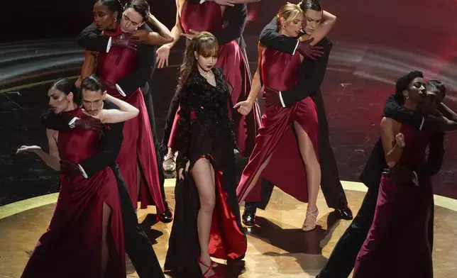 Lisa, center, sings "Live and Let Die" during the Oscars on Sunday, March 2, 2025, at the Dolby Theatre in Los Angeles. (AP Photo/Chris Pizzello)