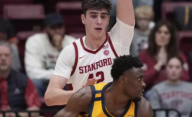 Stanford forward Maxime Raynaud, rear, defends against California center Mady Sissoko during the first half of an NCAA college basketball game Saturday, Feb. 22, 2025, in Stanford, Calif. (AP Photo/Godofredo A. Vásquez)