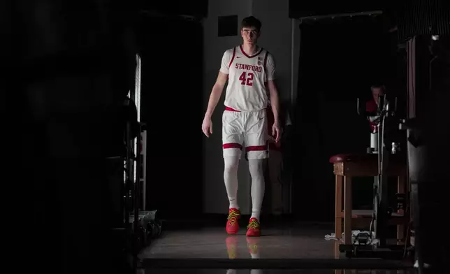 Stanford forward Maxime Raynaud (42) is introduced for the start of an NCAA college basketball game against California, Saturday, Feb. 22, 2025, in Stanford, Calif. (AP Photo/Godofredo A. Vásquez)