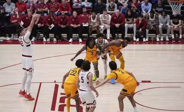 Stanford forward Maxime Raynaud, left, shoots a free throw during the second half of an NCAA college basketball game against California, Saturday, Feb. 22, 2025, in Stanford, Calif. (AP Photo/Godofredo A. Vásquez)