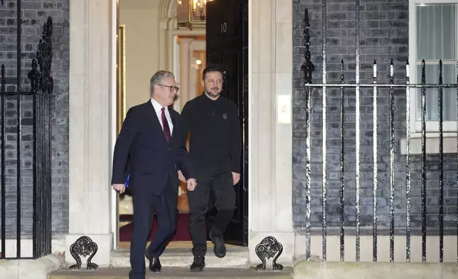 Britain's Prime Minister Keir Starmer, escorts Ukraine's President Volodymyr Zelenskyy to his waiting car as he leaves 10 Downing Street in London Saturday, March 1, 2025. (AP Photo/Kin Cheung)