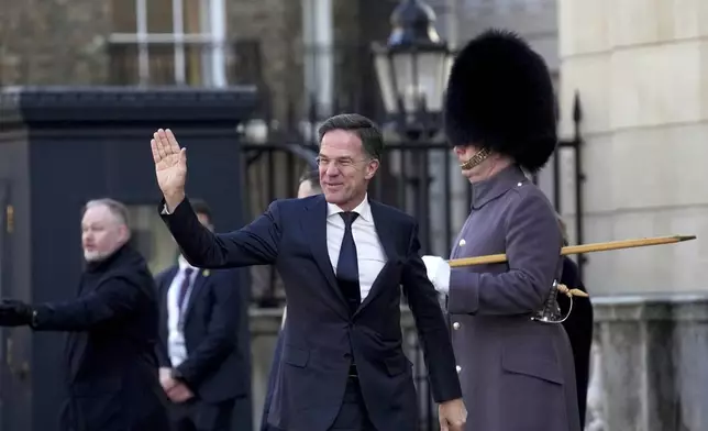 NATO Secretary General Mark Rutte waves as he arrives for a summit on Ukraine at Lancaster House in London, Sunday, March 2, 2025. (AP Photo/Christophe Ena, Pool)