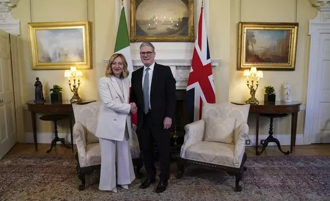 Britain's Prime Minster Keir Starmer welcomes the Prime Minister of Italy Giorgia Meloni, inside 10 Downing Street, London, Sunday March 2, 2025. (Ben Whitley/Pool via AP)