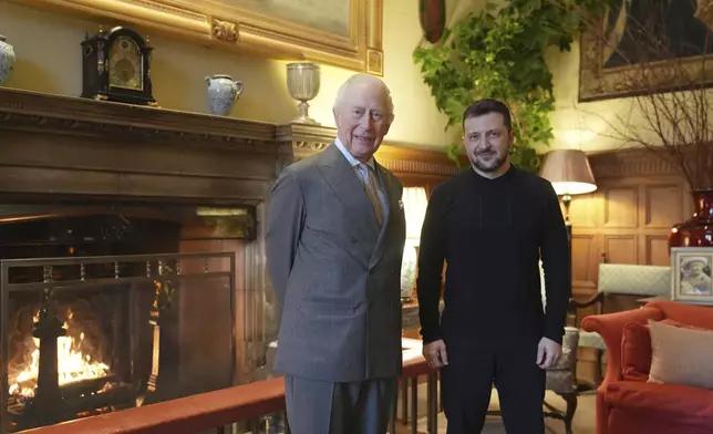 Britain's King Charles III and Ukrainian President Volodymyr Zelenskyy, right, pose for a picture during their meeting at the Sandringham Estate in Norfolk, England, Sunday, March 2, 2025. (Joe Giddens/Pool via AP)
