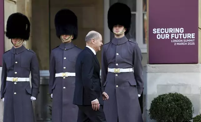 German Chancellor Olaf Scholz arrives for the European leaders' summit to discuss Ukraine, hosted by Britain's Prime Minister Keir Starmer, at Lancaster House, London, Sunday March 2, 2025. (Toby Melville/Pool via AP)