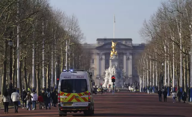 Police patrol along the Mall towards Buckingham Palace and near to Lancaster House where Britain's Prime Minister Keir Starmer will chair a Ukraine Summit with leaders from Europe and Canada in London, Sunday, March 2, 2025. (AP Photo/Alberto Pezzali)