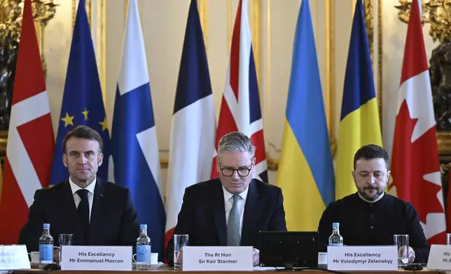 Britain's Prime Minister Keir Starmer, center, France's President Emmanuel Macron, left, and Ukraine's President Volodymyr Zelenskyy at the European leaders' summit to discuss Ukraine, at Lancaster House, London, Sunday March 2, 2025. (Justin Tallis/Pool via AP)