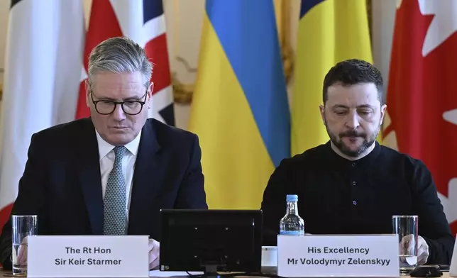 Britain's Prime Minister Keir Starmer, left, and Ukraine's President Volodymyr Zelenskyy at the European leaders' summit to discuss Ukraine, at Lancaster House, London, Sunday March 2, 2025. (Justin Tallis/Pool via AP)