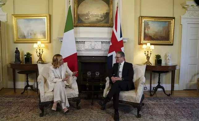 Britain's Prime Minster Keir Starmer with the Prime Minister of Italy Giorgia Meloni, inside 10 Downing Street, London, Sunday March 2, 2025. (Ben Whitley/Pool via AP)