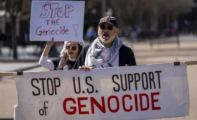 People protest against the war in Gaza outside the White House in Washington, Tuesday, March 18, 2025. (AP Photo/Ben Curtis)