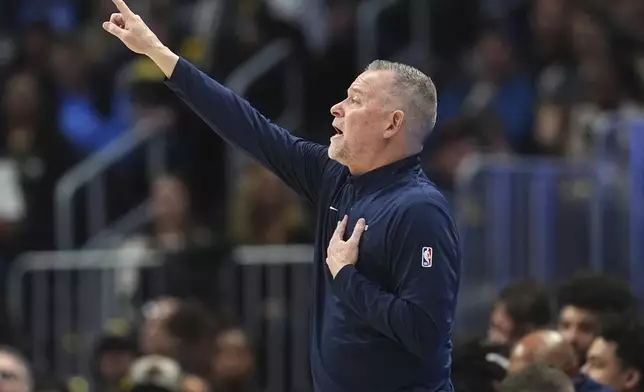 Denver Nuggets head coach Michael Malone directs his team against the Sacramento Kings in the first half of an NBA basketball game Wednesday, March 5, 2025, in Denver. (AP Photo/David Zalubowski)