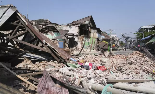 Damaged buildings are seen in the aftermath of an earthquake in Naypyitaw, Myanmar, Sunday, March 30, 2025. (AP Photo/Aung Shine Oo)