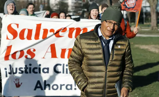 Peruvian farmer Luciano Lliuya arrives at the Higher Regional Court in Hamm, Germany, for a first hearing of his climate damages case against the German energy company RWE for its carbon emissions, which may have been contributing to the melting of a nearby glacier that could flood his home, Monday, March 17, 2025. (AP Photo/Martin Meissner)