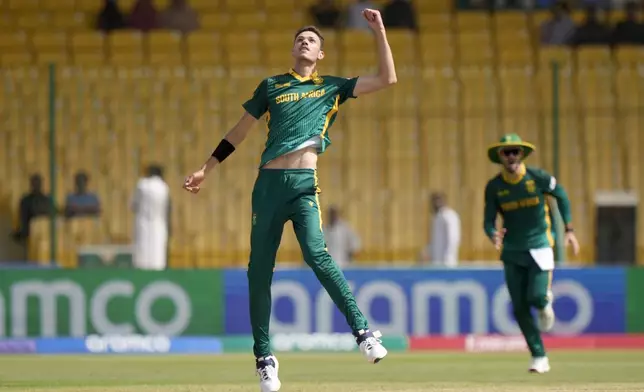 South Africa's Marco Jansen celebrates after taking the catch of England's Ben Duckett during the ICC Champions Trophy cricket match between England and South Africa, in Karachi, Pakistan Saturday, March 1, 2025. (AP Photo/Anjum Naveed)