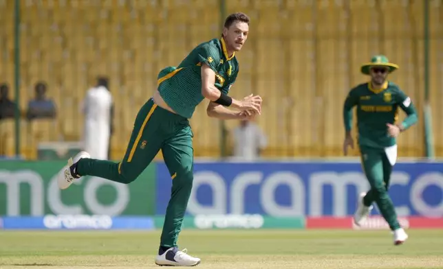 South Africa's Marco Jansen, center, takes the catch of England's Ben Duckett during the ICC Champions Trophy cricket match between England and South Africa, in Karachi, Pakistan Saturday, March 1, 2025. (AP Photo/Anjum Naveed)