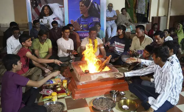 Villagers perform rituals for the safe return of American astronaut of Indian origin Suni Williams, also known as Sunita Williams, from the International Space Station (ISS), at a temple in her ancestral village Jhulasan in Mehsana district of Gujarat state in Mehsana, India, Wednesday, March 19, 2025. (AP Photo/Ajit Solanki)