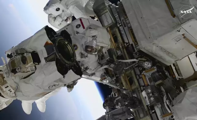 FILE - In this image from video provided by NASA, astronauts Suni Williams, foreground, and Butch Wilmore work outside the International Space Station during a spacewalk, Thursday, Jan. 30, 2025. (AP Photo/NASA TV, File)