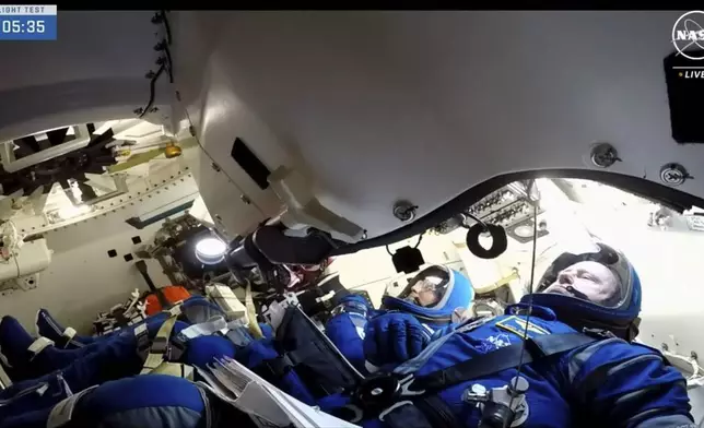 FILE - In this image from video provided by NASA, astronauts Butch Wilmore, right and Suni Williams wait for liftoff inside a Boeing Starliner capsule at Space Launch Complex 41 in Cape Canaveral, Fla., on Wednesday, June 5, 2024, for a trip to the International Space Station. (NASA via AP, File)