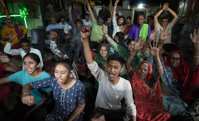 Villagers cheer as they celebrate the safe return of NASA astronaut Suni Williams, also known as Sunita Williams, from the International Space Station (ISS), at a temple in her ancestral village Jhulasan in Mehsana district of Gujarat state, India, Wednesday, March 19, 2025. (AP Photo/Ajit Solanki)