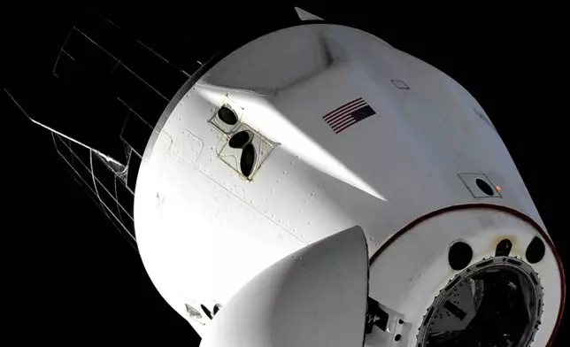 This image taken from NASA video shows the SpaceX capsule carrying NASA astronauts Suni Williams, Butch Wilmore and Nick Hague, and Russian astronaut Alexander Gorbunov, undocking from the International Space Station on Tuesday, March 18, 2025. (NASA via AP)