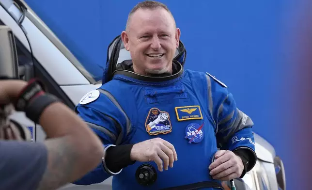 FILE _ NASA astronaut Butch Wilmore smiles after leaving the operations and checkout building for a trip to launch pad at Space Launch Complex 41 Saturday, June 1, 2024, in Cape Canaveral, Fla. (AP Photo/John Raoux, File)