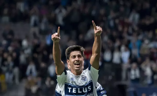 Vancouver Whitecaps' Mathias Laborda celebrates after his goal against CF Montreal during the first half of an MLS soccer match in Vancouver, British Columbia, Saturday, March 8, 2025. (Ethan Cairns/The Canadian Press via AP)